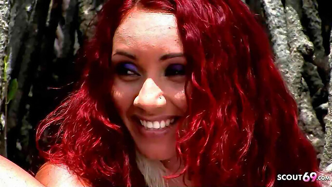 Marcia, a Latina teen with curly red hair, engages in outdoor sex on the beach in this explicit video