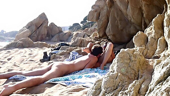 A Couple Engages In Passionate Lovemaking On The Sandy Shores