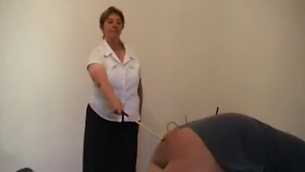 Mature Woman Punishes Man With A Cane