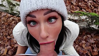 Young brunette Shaiden Rogue gives a deep throat blowjob in the woods