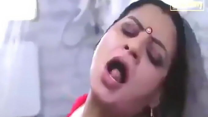 Busty aunty's sensual foreplay in Indian housewife video