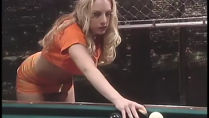 A curvy blonde receives anal fingering and penetration with a pool cue during a public gathering